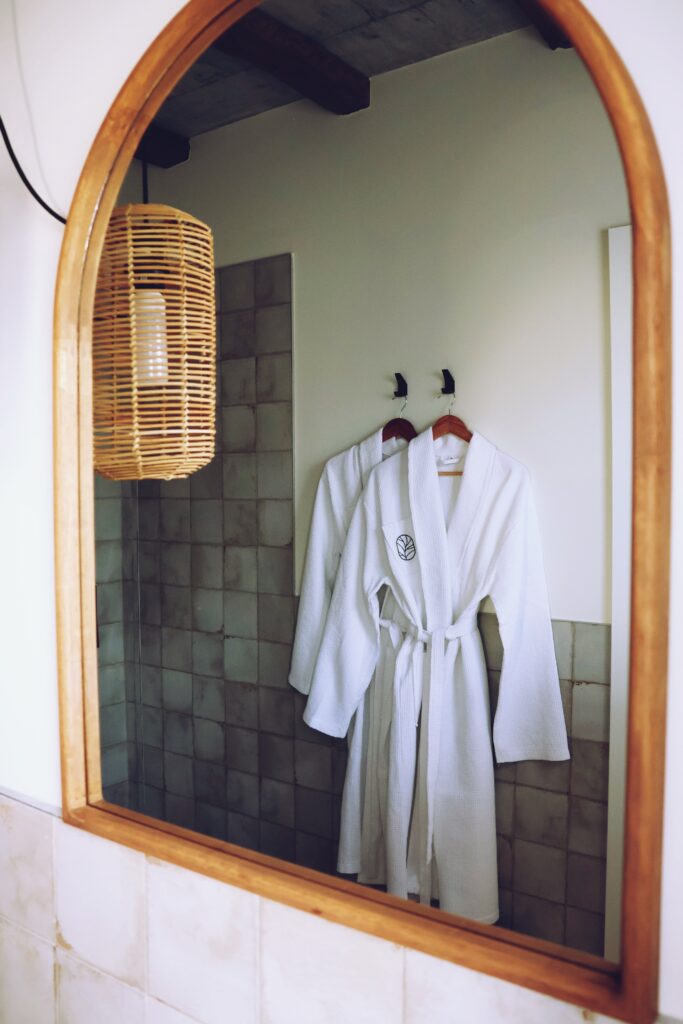 Bathrobe reflection in bathroom mirror Villaverde Village